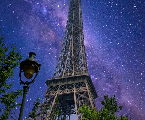 The Paris Eiffel Tower at Night with Stars.